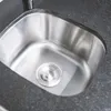 A close-up view of a stainless steel sink with a granite countertop. Náhled obrázku produktu