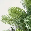 A close-up view of artificial Christmas tree branches and needles. Produktbild-Vorschau