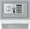 A close-up view of a gray safe with a digital keypad and a key lock. Produktbild-Vorschau