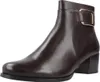 A single brown leather boot with a gold buckle detail is shown against a white background. Voir les images du produit
