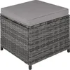 A close-up, studio shot of a gray rattan ottoman with a gray cushion on top, isolated on a white background. Náhled obrázku produktu