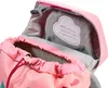 Close-up view of the inside of a pink backpack, showing the drawstring closure and a name tag. Podgląd zdjęcia produktu