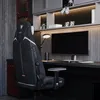 A gaming chair in a modern desk setup with a computer monitor. Anteprima dell’immagine prodotto
