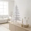 A white artificial Christmas tree is displayed on a wooden cabinet in a bright, modern living room setting. Produktbild-Vorschau