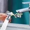 A hand is holding a faucet extender that is spraying water into a sink. Podgląd zdjęcia produktu