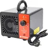 A close-up studio shot of a gray and orange ozone generator with a black handle and power cord. Podgląd zdjęcia produktu