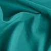 A close-up shot of teal fabric, showing its texture and folds. Produktbild-Vorschau
