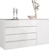 A white dresser with four drawers and a cabinet door, decorated with two silver ballerina figurines, a beige bowl, and a vase with dried flowers. Produktbild-Vorschau