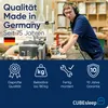 A man working in a workshop with woodworking machinery, with text overlays highlighting product features and quality. Produktbild-Vorschau