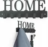 Two views of a black metal wall-mounted coat rack with the word 'HOME' cut out above the hooks. Náhľad obrázku produktu