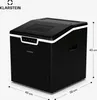 A black ice maker with dimensions indicated by lines and text. Náhled obrázku produktu