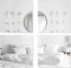 A collage of images showing a bedroom interior with decorative dried flowers on the wall and a bed with white linens. Produktbild-Vorschau