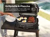 A person is using a grill with a combined grill plate and plancha, cooking steaks and eggs outdoors by a pool. Voir les images du produit