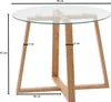 A round glass-top table with wooden legs. Anteprima dell’immagine prodotto