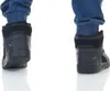 Close-up of the back of two black Puma sneakers. Produktbild-Vorschau