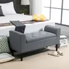 A bedroom scene with a bed, a storage bench, and pillows. Podgląd zdjęcia produktu