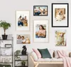 A collection of framed pictures of corgis displayed on a wall above a sofa. Produktbild-Vorschau