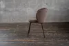 A single chair is shown against a concrete wall and wooden floor. Produktbild-Vorschau