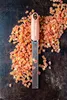 A Microplane grater is placed on a pile of diced dried fruit. Anteprima dell’immagine prodotto
