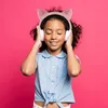A young girl wearing headphones with cat ears, listening to music. Náhľad obrázku produktu