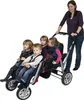 A woman pushing a multi-child stroller with four children in it. Produktbild-Vorschau
