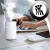 A person is working on a laptop with a humidifier and calculator on the desk. Produktbild-Vorschau