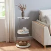 A side table with decorative items next to a sofa. Podgląd zdjęcia produktu