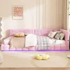 A pink upholstered bed with LED lighting and decorative pillows in a bedroom setting. Náhled obrázku produktu