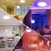 A collage of four different room settings showcasing a ceiling light in various colors and moods. Produktbild-Vorschau