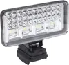 A close-up studio shot of a portable LED work light with a black base and a silver and white light panel. Anteprima dell’immagine prodotto