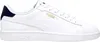 A white Puma sneaker with a navy blue heel accent. Produktbild-Vorschau