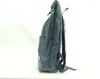 A side view of a dark gray roll-top rucksack on a white background. Produktbild-Vorschau