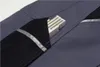 A close-up view of a gray work pant pocket with a folding ruler inside. Produktbild-Vorschau