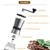 A detailed diagram of a coffee grinder, highlighting its components, with coffee beans and leaves in the foreground. Produktbild-Vorschau