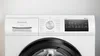 Close-up of the control panel and drum of a white Siemens washing machine. Produktbild-Vorschau