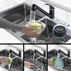 A collage of images showing a black kitchen faucet in use in a sink, demonstrating its features. Produktbild-Vorschau