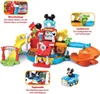 A VTech Mickey Mouse car wash and repair playset with various interactive features and accessories, shown with inset images highlighting specific functions. Produktbild-Vorschau