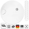 A white smoke detector is shown on a white background, with a stack of other smoke detectors to the right and several certification icons at the bottom. Produktbild-Vorschau