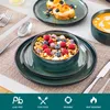 A table setting with a bowl of cereal and fruit, toast with fruit, and a bowl of soup. Voir les images du produit