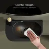 A hand is wiping a small black sink with a white cloth. The sink has a gold faucet. Anteprima dell’immagine prodotto