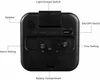 The back of a black analog alarm clock with labels pointing to its various features. Produktbild-Vorschau