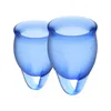 Two blue menstrual cups shown from a slightly elevated angle against a white background. Náhled obrázku produktu