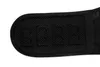 A close-up view of a black back support belt, showing its textured surface and some circular indentations. Náhľad obrázku produktu