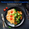 A split image showing a plate of pasta with shrimp and tomatoes on one side and a stir-fry of vegetables on the other. Produktbild-Vorschau