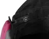 A close-up view of the inside of a pair of black work overalls, showing an adjustable elastic waistband with a button closure and a pink fabric detail. Náhled obrázku produktu