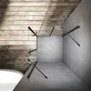 A modern bathroom corner with a glass shower enclosure, concrete walls, and a wooden accent wall. Anteprima dell’immagine prodotto