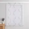 A white sheer curtain with a grey wavy pattern and small dots, hanging in front of a window. Produktbild-Vorschau