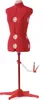 A red sewing mannequin on a stand against a white background. Produktbild-Vorschau