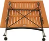 The underside of a wooden bistro table with a metal folding mechanism and wheels. Produktbild-Vorschau