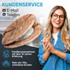 A woman is smiling and clapping her hands in front of a toilet seat with a wood grain pattern. Text overlays provide customer service information and company statistics. Produktbild-Vorschau